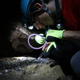 Citizen scientists with Taxon expeditions collect beetles in a cave.